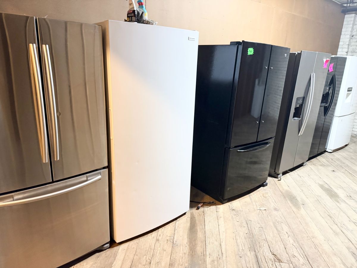 Used French door and side-by-side refrigerators for sale at the Affordable Appliance refrigerator showroom